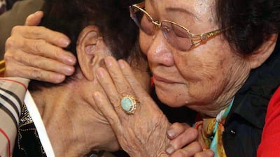 South Korean Lim Ok-Nam, right, hugs with her North Korean sister Rim Ok-Rye, left, at the Mount Kumgang resort. AFP