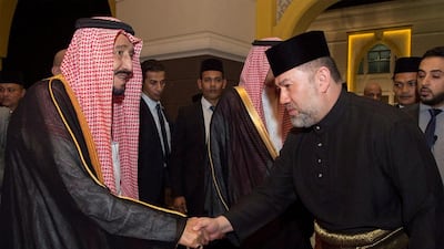 Saudi Arabia’s King Salman shakes hands with Malaysian King Muhammad V in Kuala Lumpur, Malaysia. Courtesy of Saudi Royal Court / Reuters