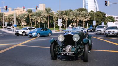 Bentley’s 4 1/2 Litre supercharged Blower, driven by brand ambassador Richard Charlesworth, on the streets of Dubai, with the Burj Al Arab in the background. Victor Besa for The National