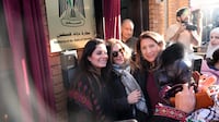 Attendees pose for a photograph at the inauguration of the Palestinian embassy, in Hammersmith, west London. PA