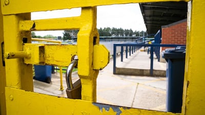 Locked gates at the Cherry Reds Record Stadium, home to AFC Wimbledon, in the UK's League One. PA