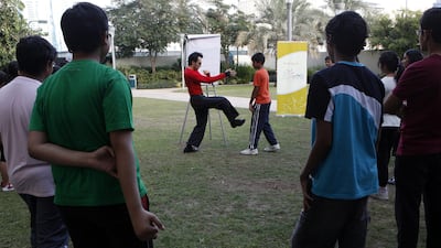 A self-defence workshop for youngsters takes place in a park in Dubai. Bullying in schools is worryingly common, according to a new study (Jeffrey E Biteng / The National)