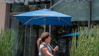 People walk past a Capital One Bank branch in Los Angeles, California. A hacker accessed more than 100 million credit card applications with US financial heavyweight Capital One, the firm said on July 29, 2019, in one of the biggest data thefts to hit a financial services company. AFP