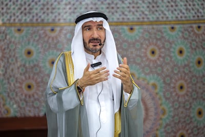 Sheikh Dr Fares Al Mustafa, religious and cultural affairs adviser, imam at Al Farooq Omar bin Al Khattab Mosque, addresses worshipper during Friday's rain prayer gathering. Dubai. Victor Besa / The National