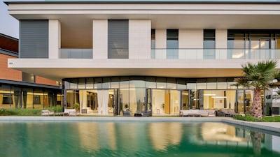 Outside there is a generously sized swimming pool. Courtesy Luxhabitat Sotheby's International Realty