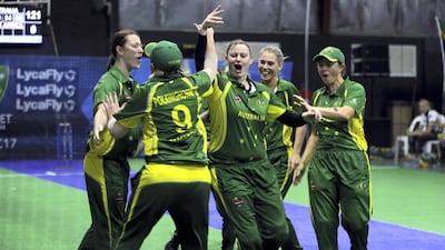 Australia players celebrate after scoring a point against South Africa during the women's final match at the Indoor Cricket World Cup in 2017 in Dubai. AP