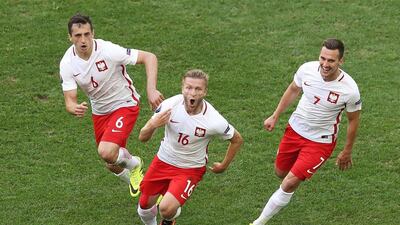 Poland's midfielder Jakub Blaszczykowski (C) celebrates after scoring against Ukraine. Valery Hache / AFP