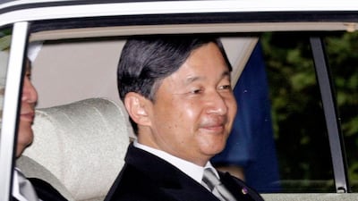 Japan's Crown Prince Naruhito, in a car, returns to the Crown Prince's Palace in Tokyo. Naruhito will ascend to the Chrysanthemum Throne on Wednesday. AP
