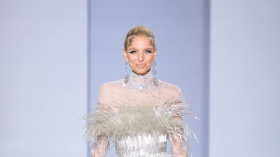 The duo's shimmering opening look set the tone for the autumn/winter 2022 to 2023 haute couture collection, Eternal Gifts.