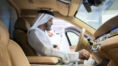 Sheikh Mohamed sits in the drivers' seat of a Russian-made Aurus armoured limousine. Ryan Carter / Ministry of Presidential Affairs
