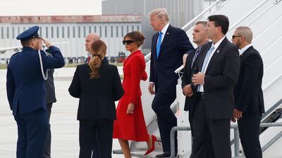 US president Donald Trump, centre right, and first lady Melania, centre left, arrive on Air Force One at Orly Airport, south of Paris, on Thursday, July 13, 2017. The president and first lady will attend the Bastille Day parade on the Champs Elysees avenue in Paris, France, on Friday, July 14, 2017. Carolyn Kaster / AP Photo