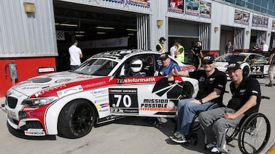 Endurance drivers Matt Speakman (inside car), left, Mike Smit, Gustav Engljaehringer and Marc Dilger make up the Mission Possible team that will race in the Dubai 24 Hours this weekend. Pawan Singh / The National