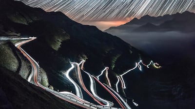 Dark contours of the Stelvio Pass in the Italian Alps in this lime-lapse night photo. Unsplash