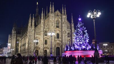 The Christmas tree is illuminated at the Piazza Duomo on December 10. EPA