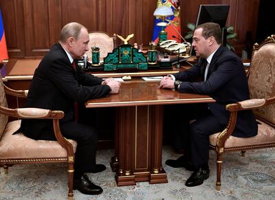 Russian President Vladimir Putin, left, listens to Russian Prime Minister Dmitry Medvedev during their meeting in the Kremlin in Moscow. Sputnik, Kremlin Pool Photo via AP
