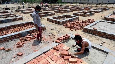 Platforms for funeral pyres are built in a field next to a crematorium in New Delhi. Covid-19 deaths in the Indian capital have soared. AFP