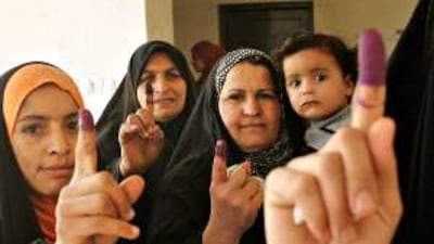 Iraqi voters emerge from a polling booth in Baquba, north-east of Baghdad, in 2010. Parliamentary elections are scheduled to be held in Iraq on October 10, 2021. AFP