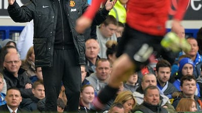 Manchester United manager David Moyes, left, gestures during the Premier League match against Everton at Goodison Park in Liverpool on April 20, 2014. Paul Ellis / AFP