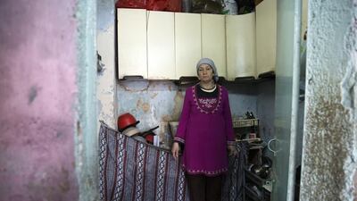 Palestinian refugee Hiam Muwad, 51, stands in the kitchen of her home in the Amari refugee camp near the central West Bank city of Al Bireh on May 9, 2016. Heidi Levine for The National