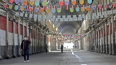 Only a few people walk in the century-old covered bazaar of Hamidiya in Syria's capital Damascus on March 24, 2020, after measures were taken by the authorities to fight the novel coronavirus pandemic. - Across much of the Syrian capital, with squares and markets once thronging with people even during the war, are now almost entirely empty. Five cases of COVID-19 have been reported in the country since Sunday, and the authorities have ordered all non-essential businesses closed. (Photo by LOUAI BESHARA / AFP)