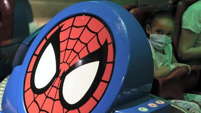 A young girl on the Spider-Man Doc Ock’s Revenge ride at IMG Worlds of Adventure. Chris Whiteoak / The National