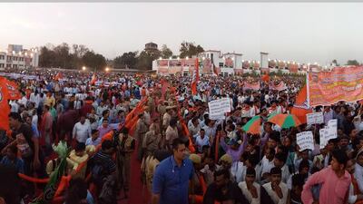 People in Yogi Adityanath’s hometown Gorakhpur gather on March 25 to welcome the chief minister of Uttar Pradesh, but Adityanath faces a battle to revive the economy. Deepak Gupta / Hindustan Times via Getty Images.