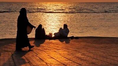 Saudis spend an evening on the seafront promenade in Jeddah, the setting for Abo Khal's disturbing novel Throwing Sparks.
