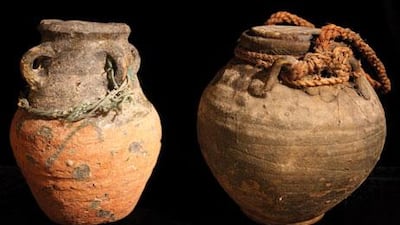 Two clay pots used to store butter milk and oil or ghee.