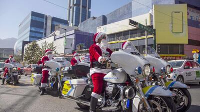 A convoy of Santas on police motorbikes in Monterrey, Mexico. AFP