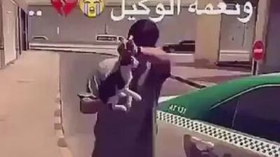 Mohammed, 17, holds the cat shortly before hurling it against a wall. Footage of the assault was posted on Twitter.