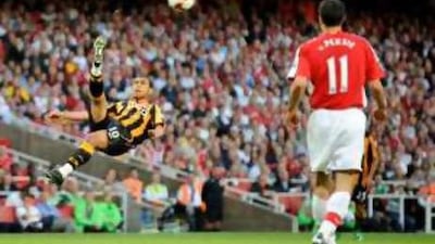 Hull City's Geovanni clears the ball spectacularly during the club's 2-1 victory at the Emirates Stadium.