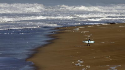 US surfer Damien Hobgood walks on the beach at Praia do Norte, Nazare, Portugal. MIGUEL A LOPES / EPA