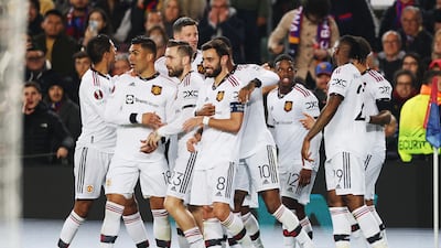 United players celebrate after Jules Kounde's own goal. PA