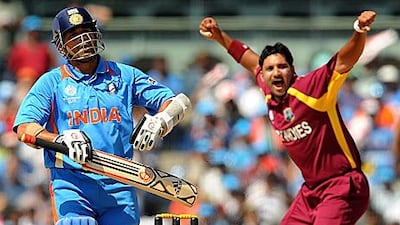 Sachin Tendulkar, left, looks towards the umpire Steve Davies, not pictured, as the West Indies paceman Ravi Rampaul appeals.