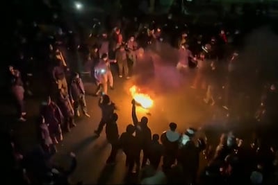A screengrab from a video taken on January 9, 2026, shows protesters gathered in the evening in Pounak Square, in Tehran. AFP