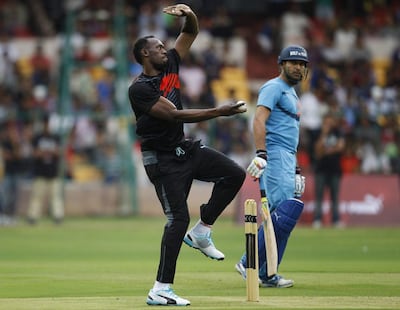 Usain Bolt takes part in an exhibition match in Bangalore, India, in September 2014. AFP