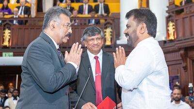 Sri Lanka's new president Anura Kumara Dissanayake, right, taking his oath of office in Colombo. Reuters