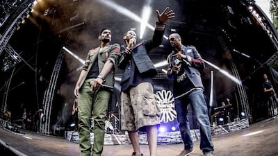 Outlandish members, from left, Waqas, Isam B and Lenny Martinez. PYMCA / UIG via Getty Images