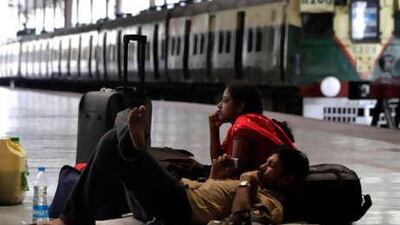 A stranded couple waits on a railway platform during a strike in Calcutta, India.