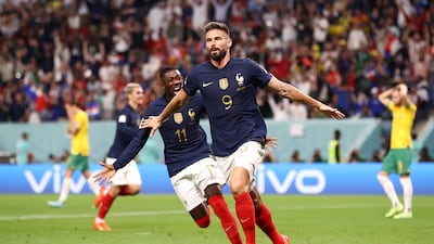Olivier Giroud celebrates scoring France's second goal, his 50th for his country, with teammate Ousmane Dembele. Getty