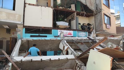 People search a collapsed building in Portoviejo, Ecuador. Carlos Sacoto / AP Photo