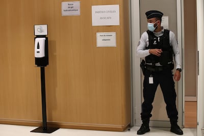 A police officer guards the courtroom at the Paris Hall of Justice on Wednesday. AP