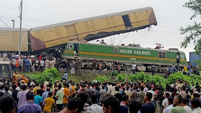 The crash caused two of the passenger train's carriages to derail near New Jalpaiguri station, in West Bengal state. AP