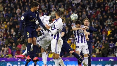 Real Madrid's Spanish defender Nacho heads the ball to score the only goal of the match. AFP