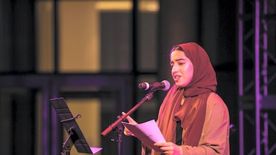 Maitha AlSuwaidi, a student at NYUAD, read a long poem that made the connection between family roots and our sense of “home". Courtesy Nikith Nath
