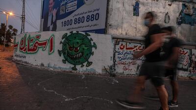 A graffiti seen in the streets amid the ongoing coronavirus pandemic, in Gaza City. The Gaza Strip is under a nationwide lockdown from August 25. EPA