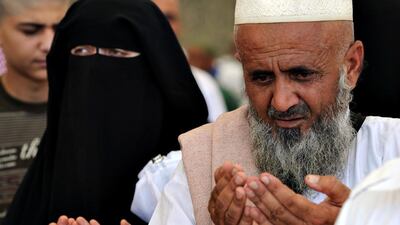 Muslim pilgrims pray after taking part in the 'Jamarat' ritual, the stoning of Satan, in Mina, near the holy city of Mecca. Fayez Nureldine / AFP