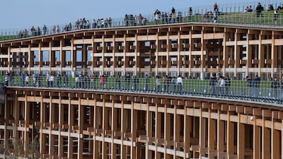 The grand ring is one of the world's largest elevated wooden structures and is a central feature of the Expo. Victor Besa / The National