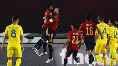 Sergio Ramos celebrates with Ansu Fati (L) after scoring the opening goal for Spain against Ukraine. EPA
