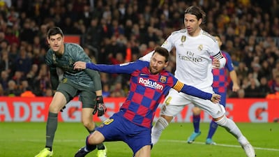 Barcelona's Lionel Messi in action with Real Madrid goalkeeper Thibaut Courtois and Sergio Ramos. AP